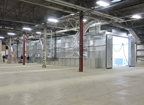 Why a Downdraft Booth is a Game-Changer for Heavy Equipment Finishing